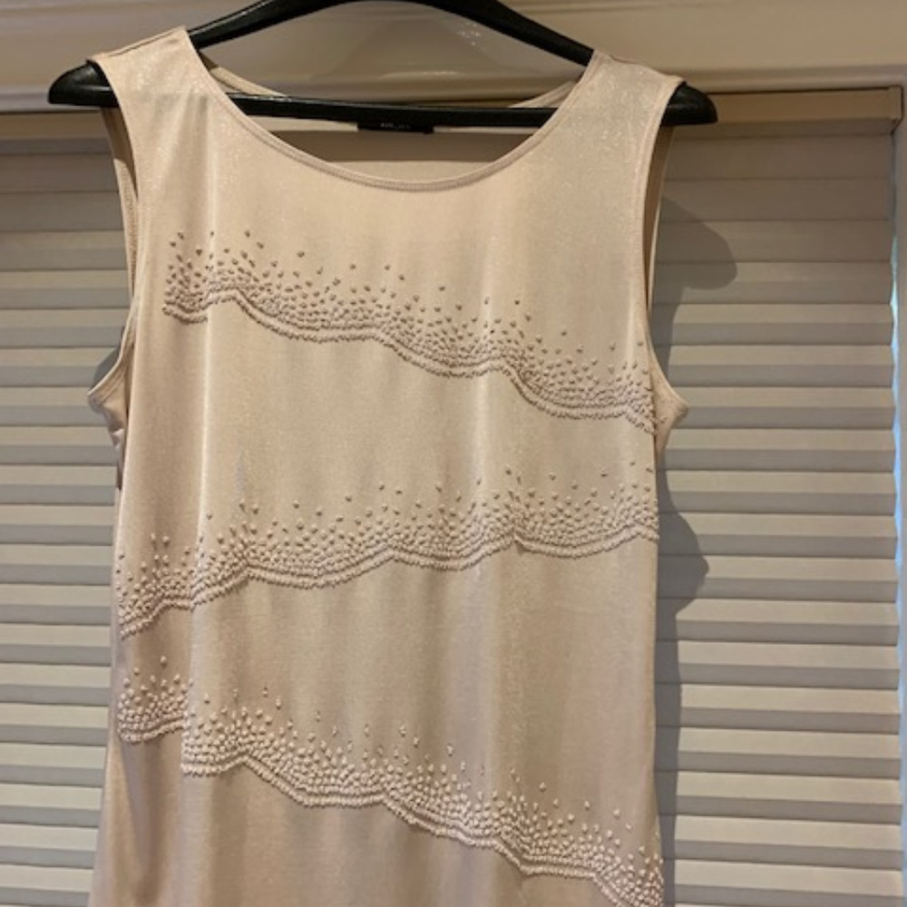 light pink shell with beading